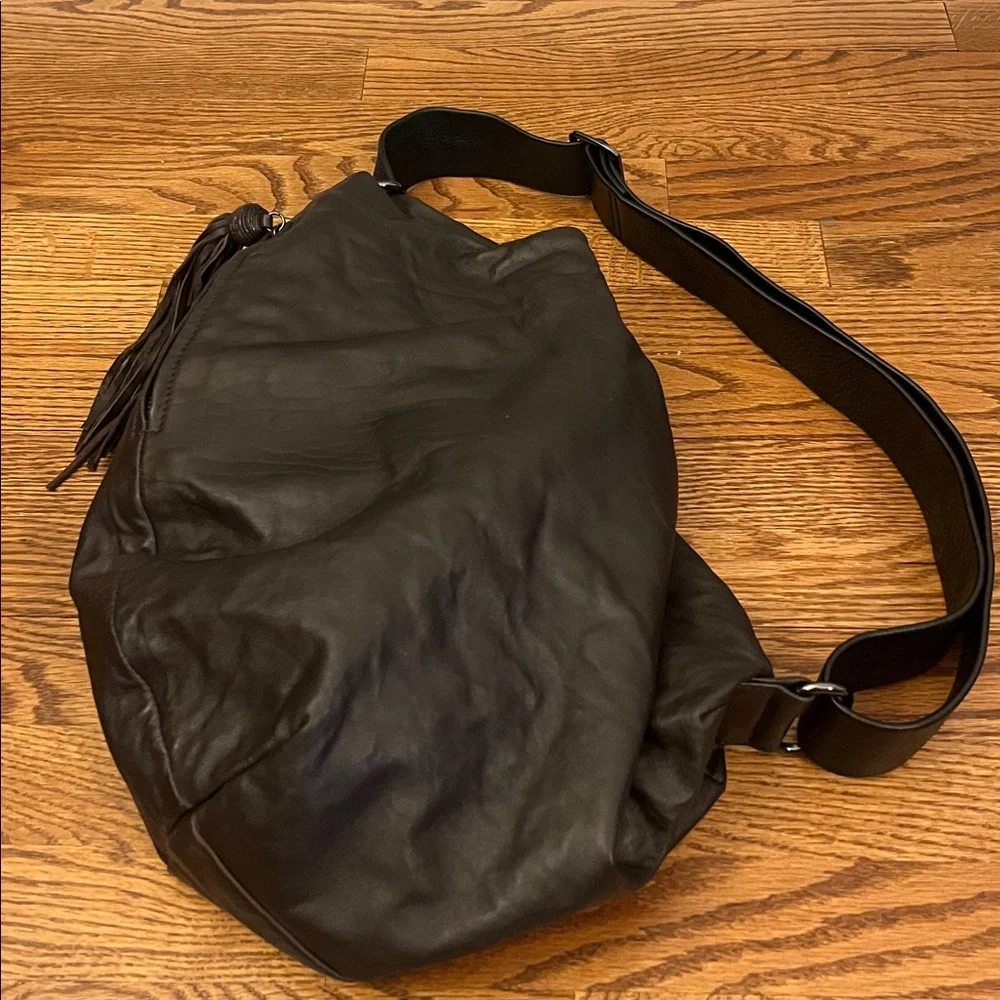 DanAzan slouchy one shoulder bag in brown leather with black adjustable strap